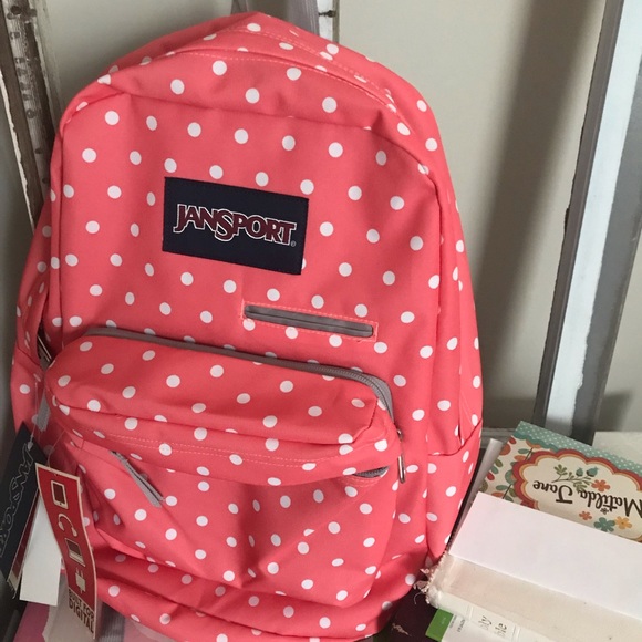 peach colored jansport backpack